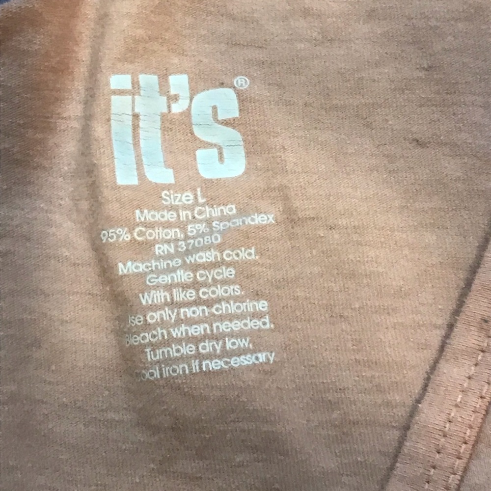 A It’s Cream colored Long sleeved shirt